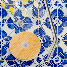 Load image into Gallery viewer, Glass with lemon design on top of blue and white Portuguese tiles
