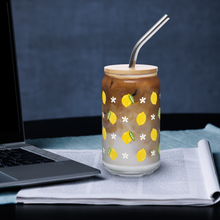 Load image into Gallery viewer, Glass with lemon design filled with iced coffee on a desk with a laptop