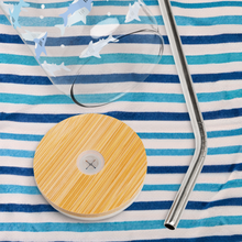 Load image into Gallery viewer, Glass with shark design on top of a blue striped beach towel