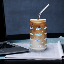 Load image into Gallery viewer, Glass with shark design filled with iced coffee on a desk with a laptop