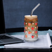 Load image into Gallery viewer, Glass with strawberry design filled with iced coffee on a desk with a laptop