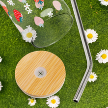 Load image into Gallery viewer, Glass with strawberry design on grass with daisies