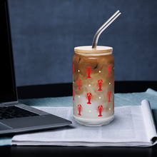 Load image into Gallery viewer, Glass with lobster design filled with iced coffee on a desk with laptop
