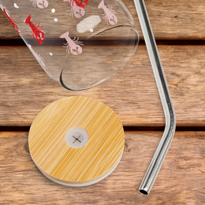 Glass with lobster design on a wooden table